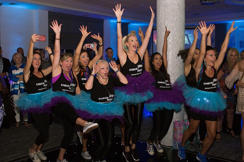 The scavenger hunt winners, Checkmates, celebrate their win.