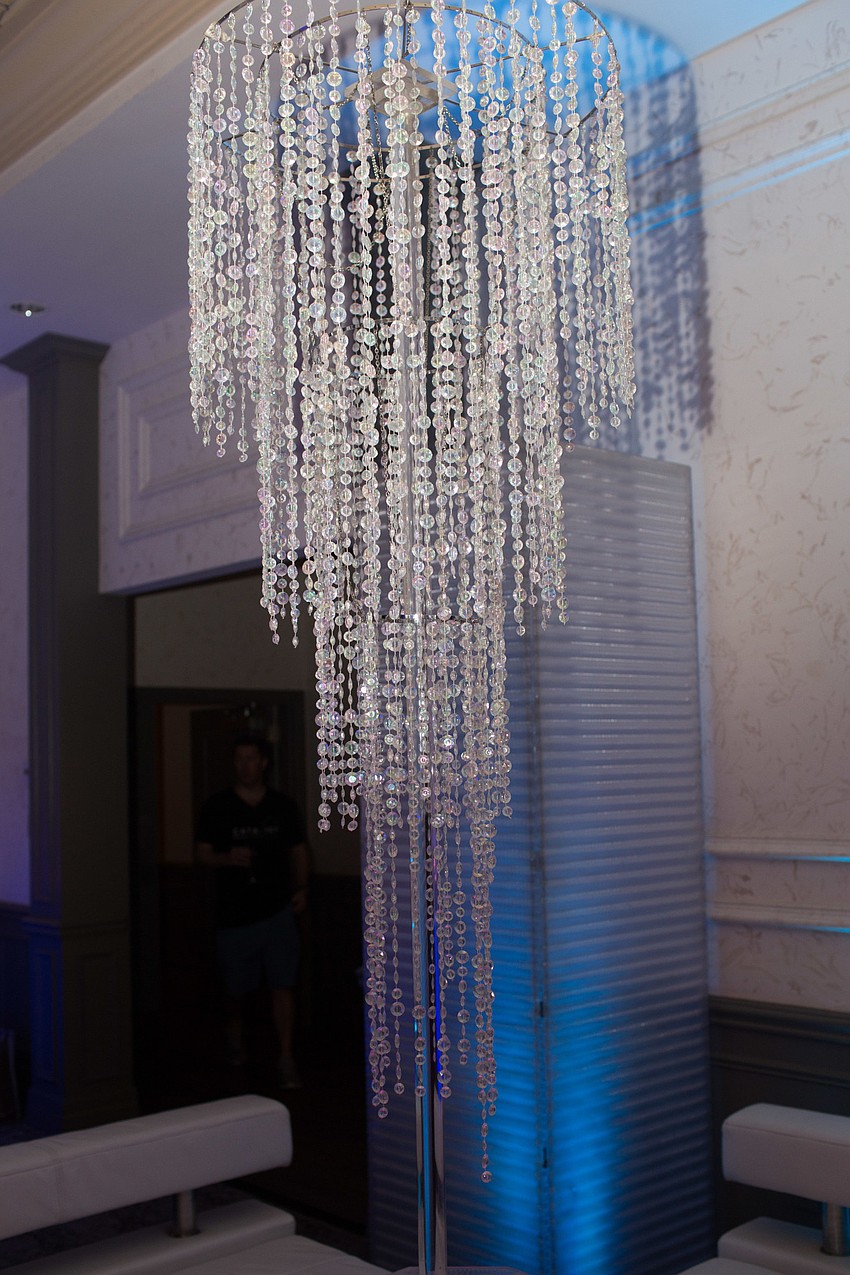 Crystal chandeliers sparkled amongst the colorful lights.