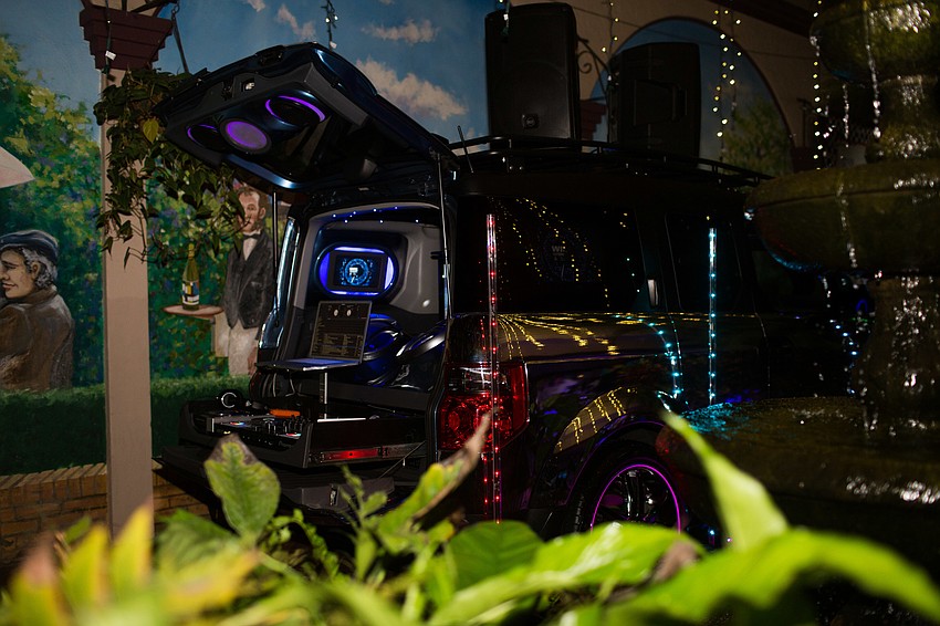 A DJ set-up outside was inside a chrome car.