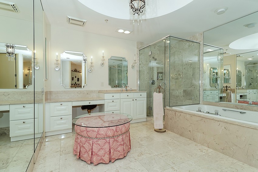 Three baths and a half bath are featured in the condo.