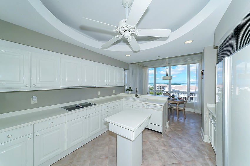 The kitchen is finished entirely in white.