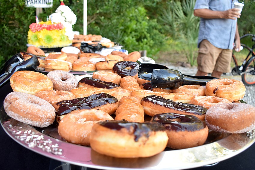 Doughnuts, coffee and juice were served along with the Longboat Observer’s 40th anniversary special section.