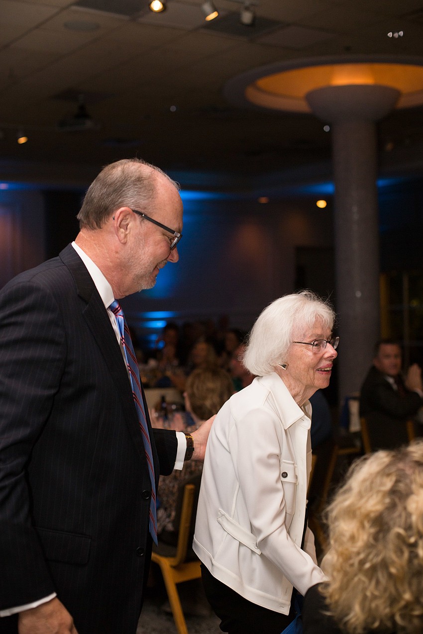 Honoree Tom Koski helps his mother as she is recognized.