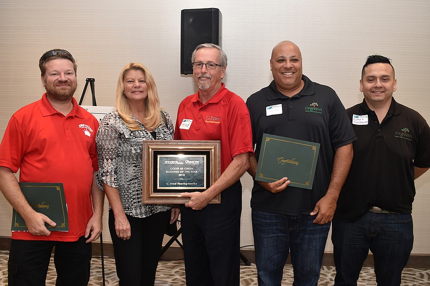 Good as Green Business of the Year second place winner Tomas Jusak of Junk King, first place winners Jacci Shovlin and Mike Solmonson of G. Fried Flooring and third place winners Angel Cruz and Ruben Rodriguez of OrgreenX