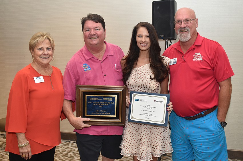 Longboat Key Chamber of Commerce President Gail Loefgren with Small Business Person of the Year (11 or more employees) first place winner John Horne, third place winner Taylor Coan and first place winner Lynn Horne