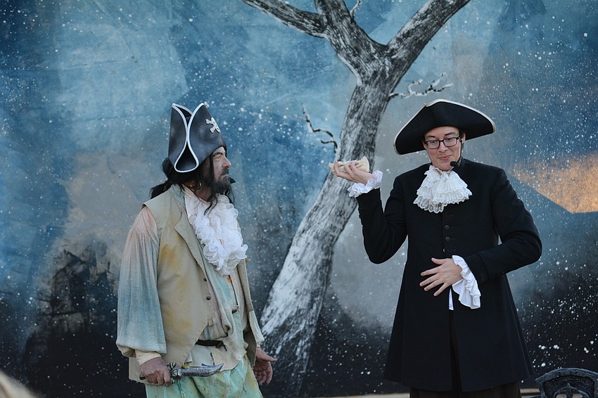 The ghost pirate, played by Derek Dutcher, emerges from the cemetery to startle and accuse Ichabod Crane, played by Philip Troyer.