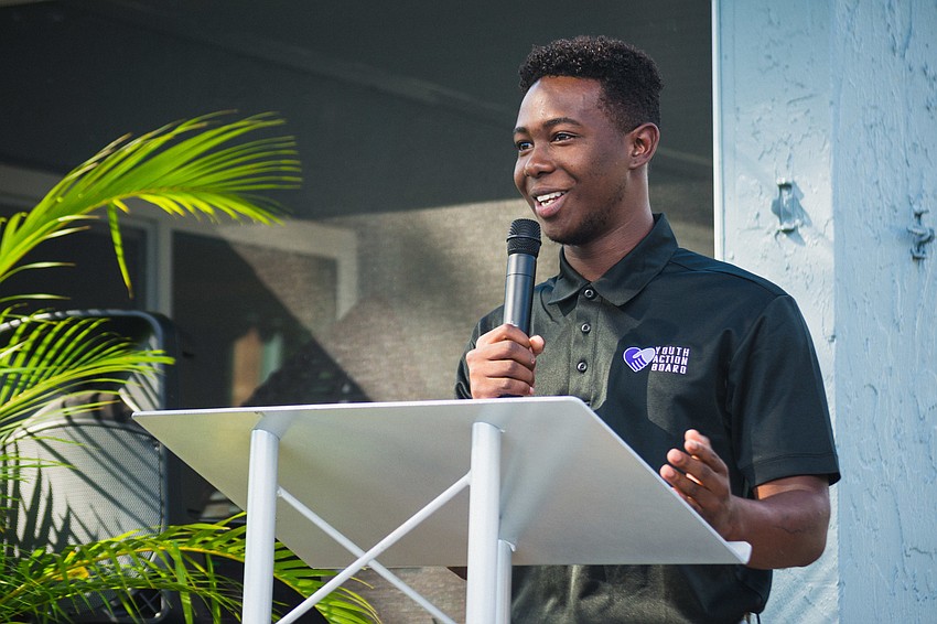 Daryll Williams, president of Harvest House's Youth Action Board, speaks at the ribbon-cutting ceremony.