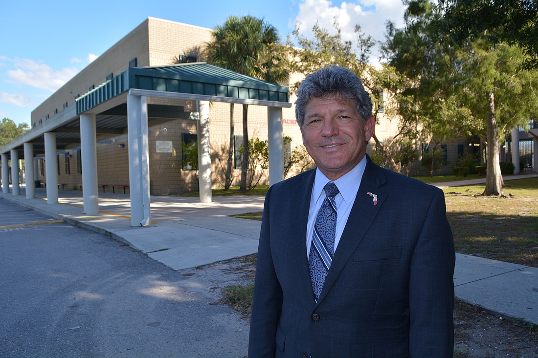 School Board member Scott Hopes met with a parent at Braden River Middle School Oct. 17 to discuss a parking issue. Hopes said the School Board needs to develop a strategic plan.