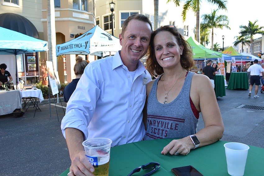 Take Stock in Children of Manatee mentor Rob Hendrickson and employee Jessica Armstrong catch up at the event.