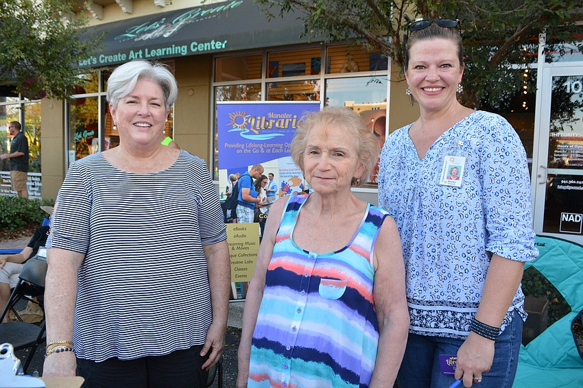 Friends of the Library volunteers Karen Krips and Joan Muschamp join Manatee County Libraries employee Becky Frazier to share information about the library system and the new library coming to Lakewood Ranch.