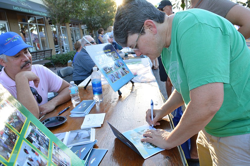 Lakewood Ranch Anglers Club member Miguel Caraballo answers all Tracy Hunter's questions. Hunter grew up fishing in both salt and fresh waters.