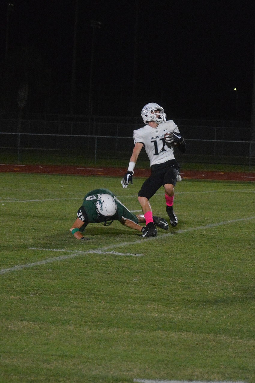 Junior wideout Robbie Goecker puts a spin move on a Lakewood Ranch defender. Goecker would score on the play.