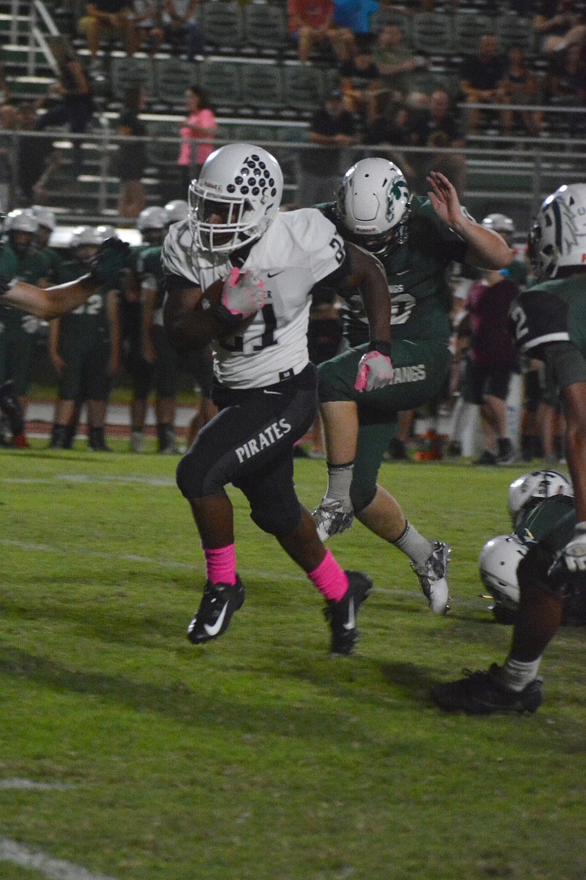 Senior Pirates running back Maurice Fedd rumbles into the end zone.