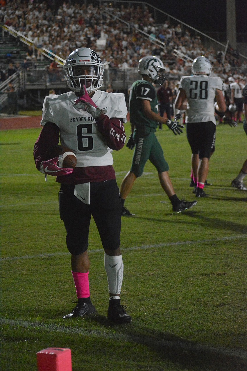 Pirates junior running back Brian Battie tells the crowd at Lakewood Ranch High to quiet down after scoring his fourth touchdown of the night.