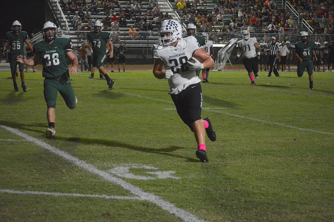 Pirates junior tight end Travis Tobey walks into the end zone after catching a pass from senior Bryan Gagg.