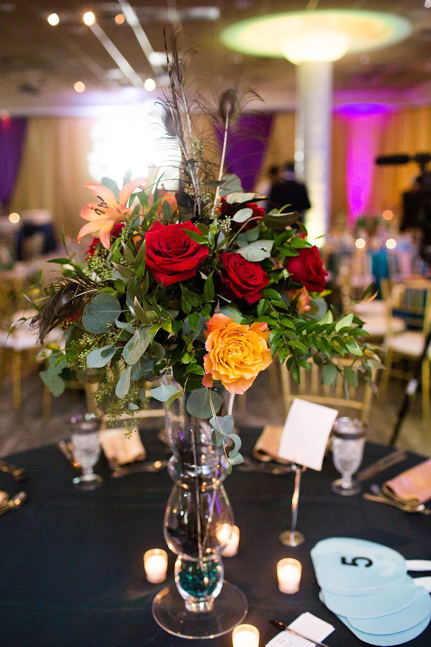 The centerpieces stood tall above the tables.