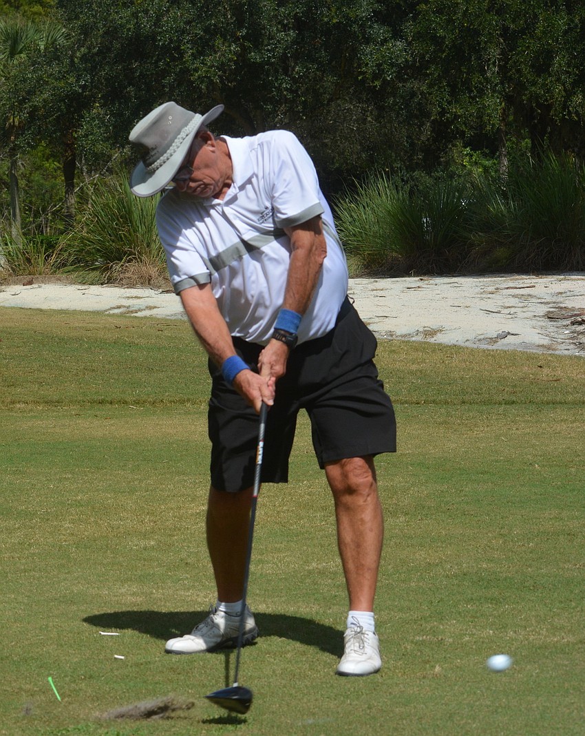 Sarasota's Bob Springer drives the ball off the first tee of the Play for Pink golf tournament.