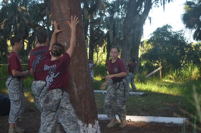 One of the captains of the Braden River team, senior Gina Pressimone, says she loves the rope bridge challenge because every team member has a job in order to correctly haul themselves between trees without touching the ground.