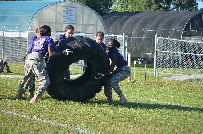 Lakewood Ranch's Sofia Uribe, Nadiya Simplson, Reagan Gross, Elisa West, and D'nasha Washington have to push a tire as fast as they can approximately 100 yards.