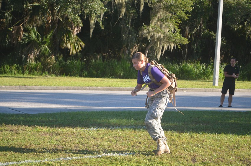 Sophomore Hannah Ramsden from Lakewood Ranch has to carry a backpack one mile, and the backpack weighs about 30 pounds to simulate the weight of a pack you would have to carry when you're active duty.