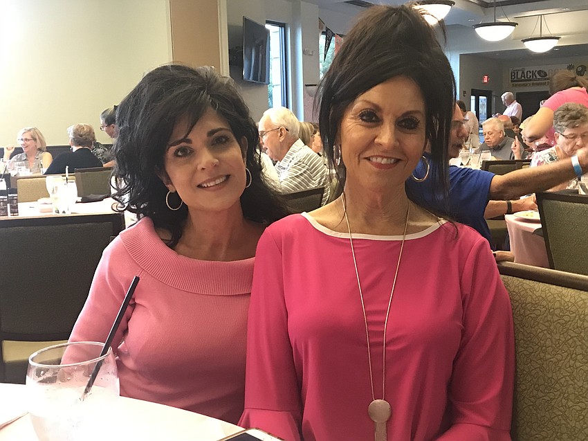 Breast cancer survivor Joanne Hampton, left, gave an emotional presentation on the comedy show Oct. 18. She is with volunteer Linda Vernon.