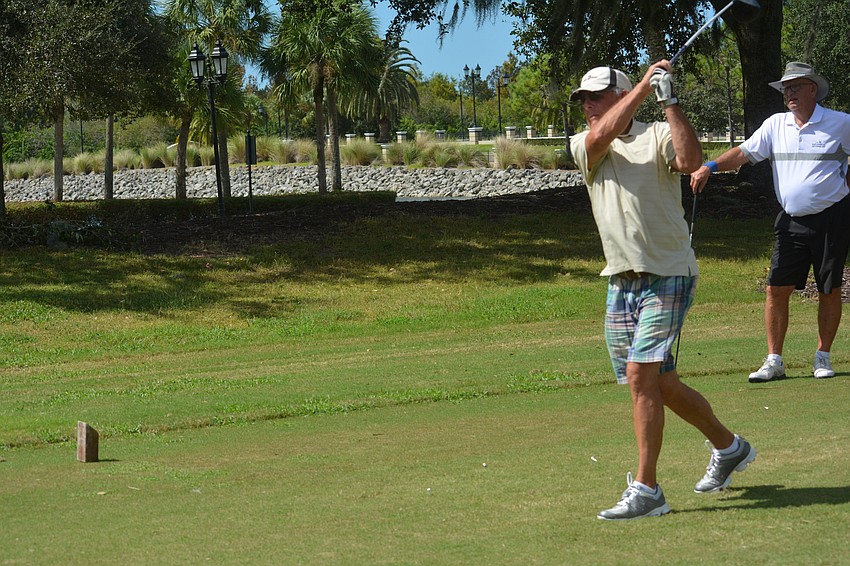 Sarasota's Butch Koch tees off at Play for Pink.