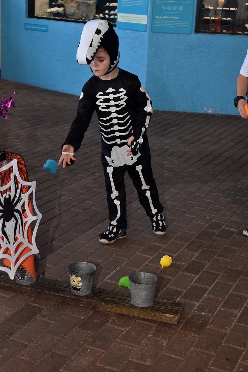 Gus Owen plays a game during Mote’s Fish, Fun and Fright.