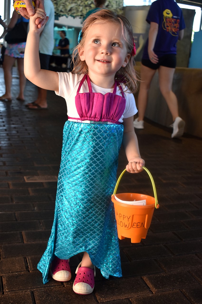 Mia Wells is all smiles as she explores Mote during the Fish, Fun and Fright event.