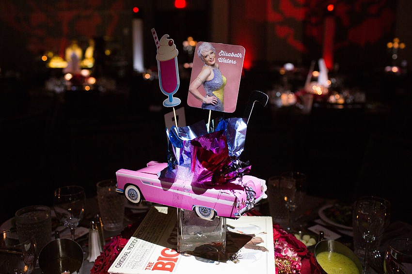 Tables were marked with Grease cars to support Elisabeth Waters.