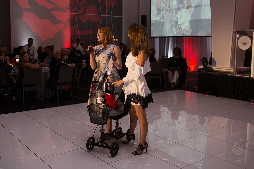 Co-Chairwomen Emily Walsh and. Jackie Rogers on stage. Co-Chairwoman Penny Hill was in Italy  that night.