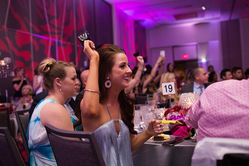 Monica Kelly cheers on her fellow dancers.