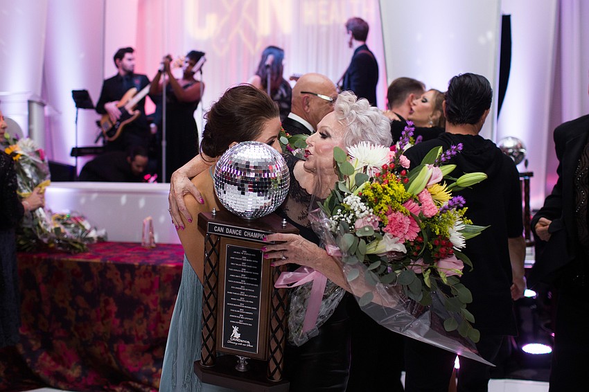 Monica Kelly and Elisabeth Waters congratulate each other.