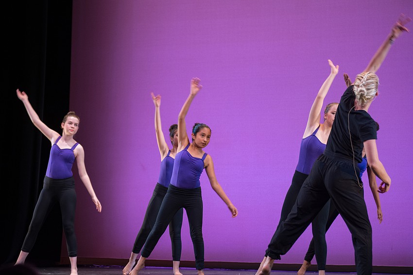 Sarasota Ballet instructor Claudia-Lynn Rightmire and DNG dancers demonstrate their dance skills to audience members.