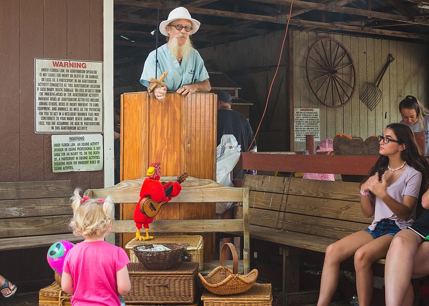 Dr. Nik performs a puppet show for festival visitors.