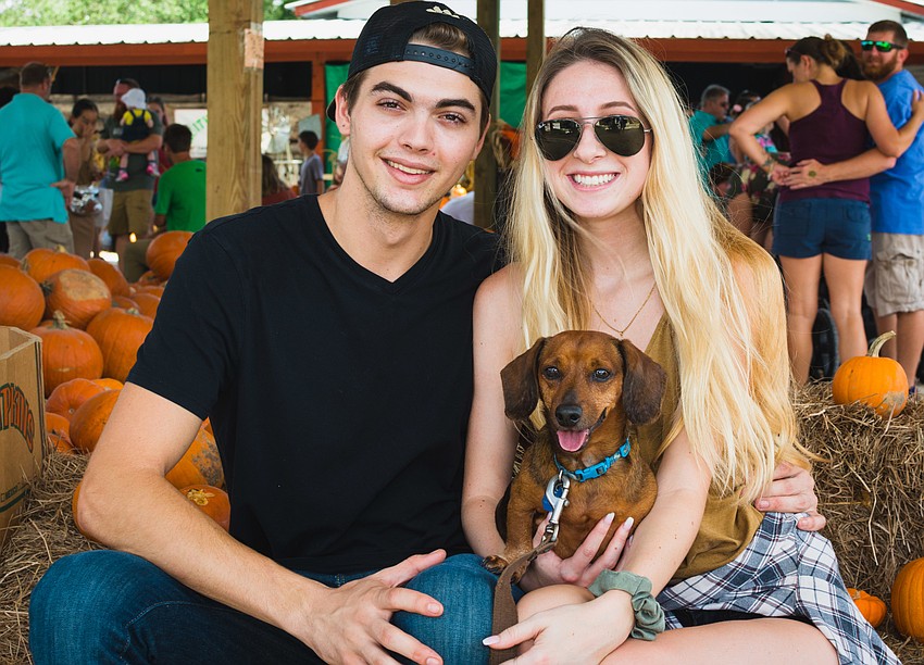 Jarek Dymek and Fresia Eckelman with their dog, Sparticus.