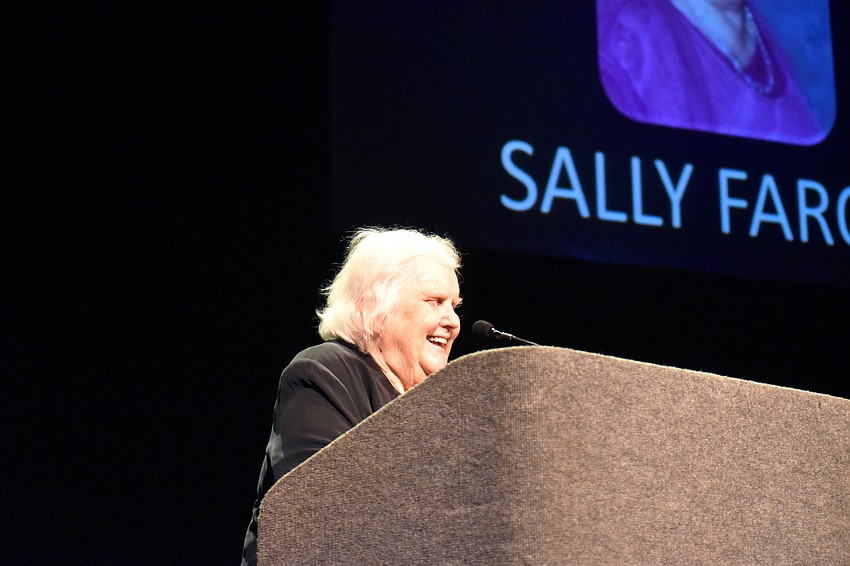 Sally Faron laughs while giving her acceptance speech for her Arts Leadership Award.