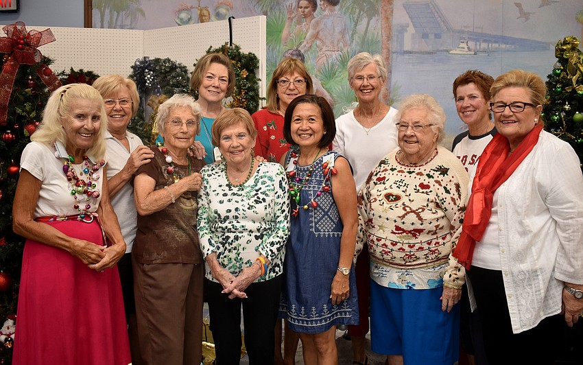 Every Thursday, event organizers, Clara McGonigle, Carol Fischbein and Andy Youngs prepare for the bazaar with a group of volunteers.