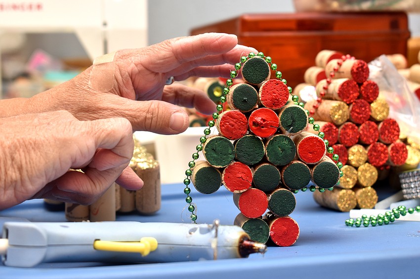 Kathy Hauser creates decorative Christmas trees out of wine corks.