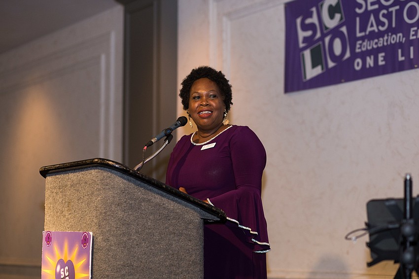 Founder and CEO April Glasco addresses the audience.