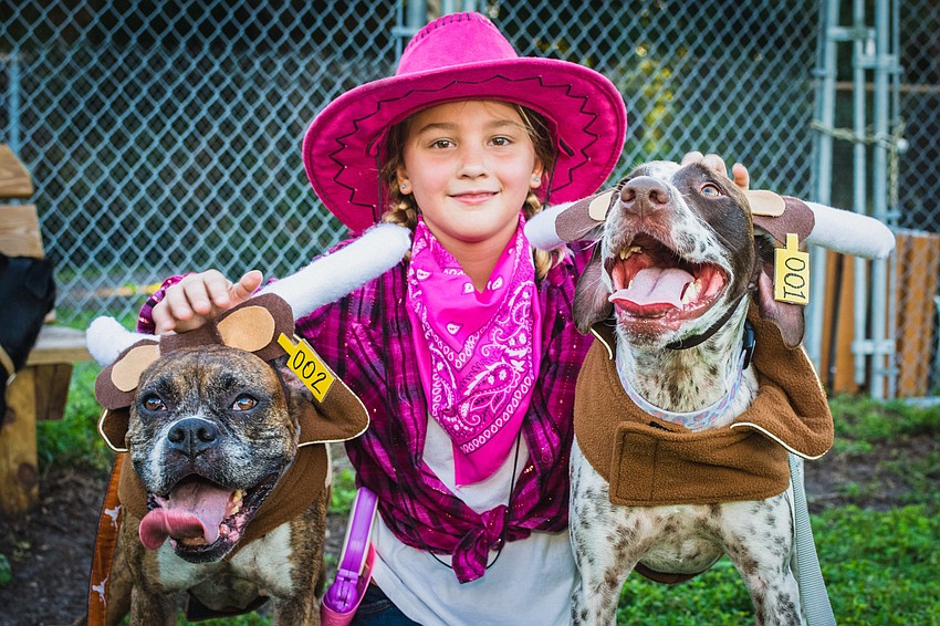Cowgirl Madeline Davis with her cattle Camile and Moose. Their ensemble won the award for Judge's Choice.