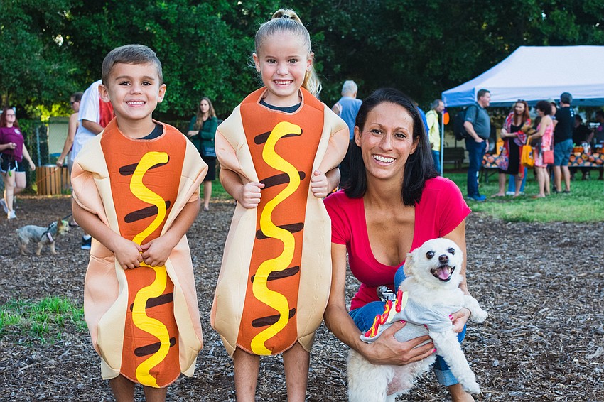 Uhtred, Selkie and Amy Garner with their dog, Bowser.