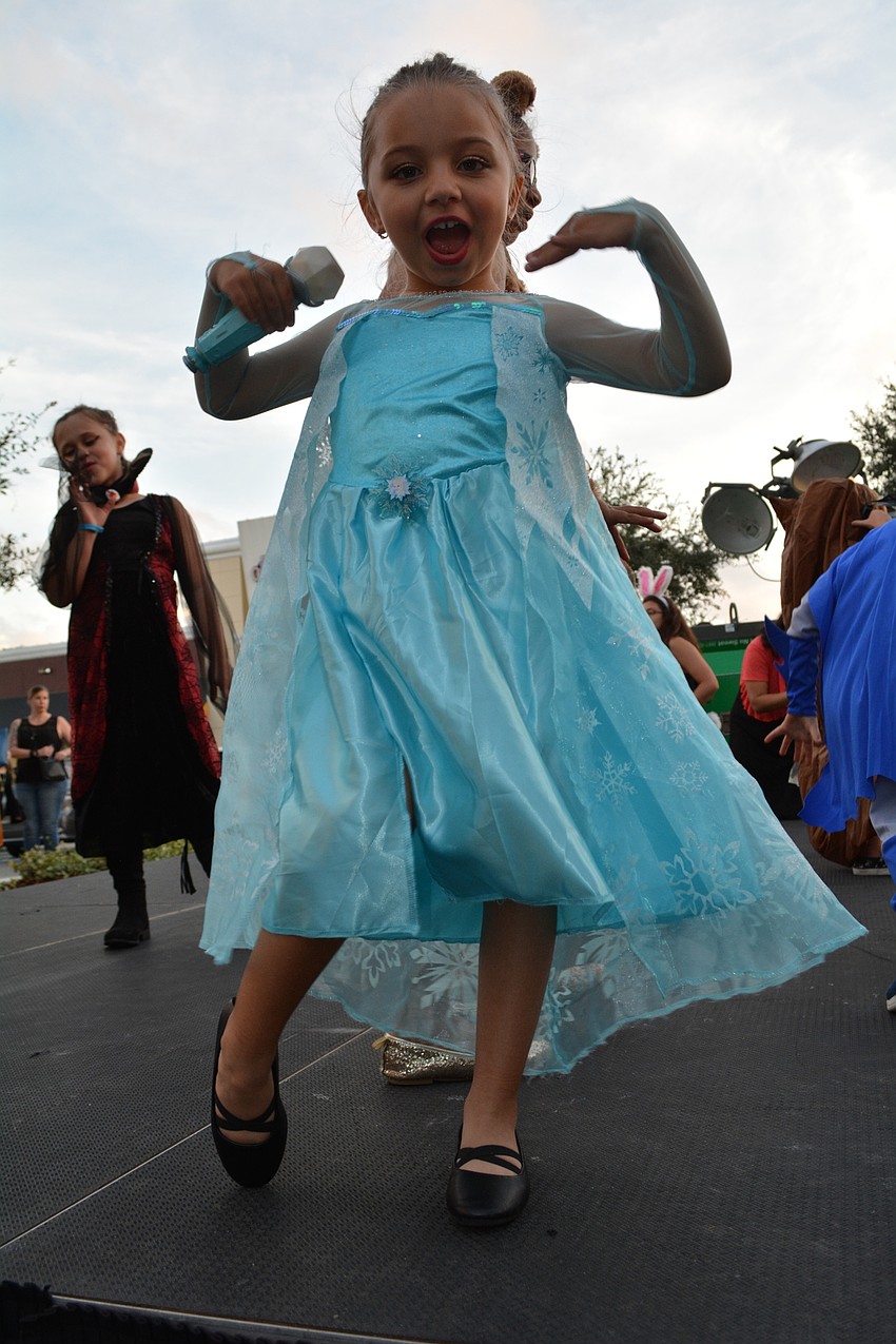 Willis Elementary School's Lily Simsek, 6, dances on stage and shows off her 