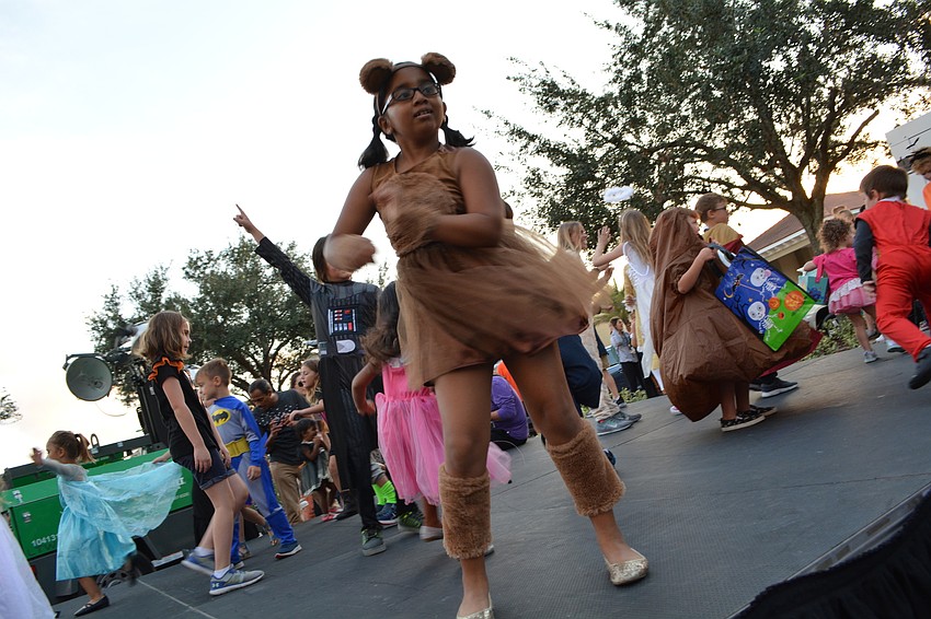 Seven-year-old Gilbert W. McNeal Elementary student Druthi Kommineni, a bear, shows off her dance moves.