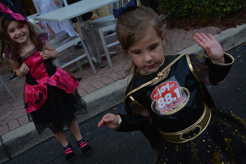 Sofia Cristello, aka Batgirl, dances with her friend, Kinsley Barnett. The 4-year-olds are in the same class at All God's Children preschool and on the same soccer team.