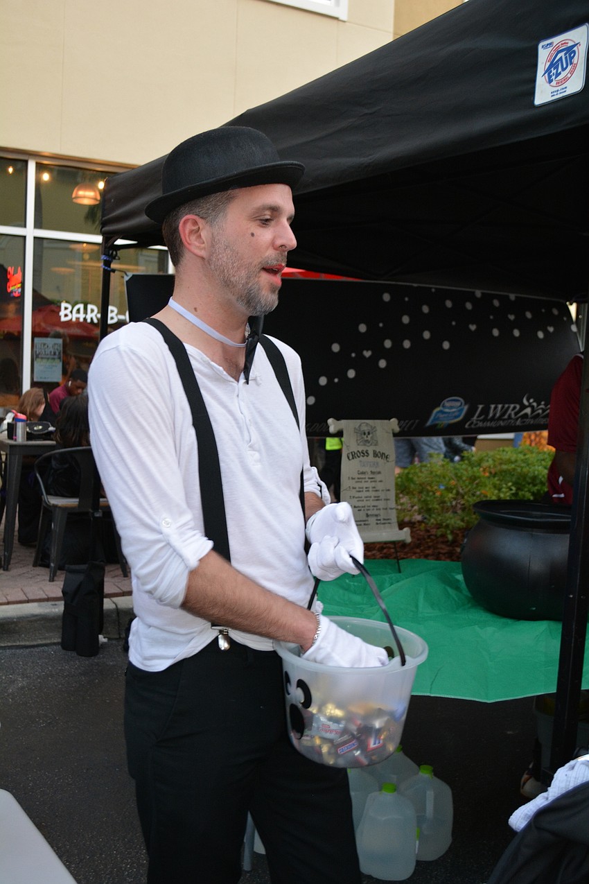 Adam Simard hands out candy for Sirius Day Spa.