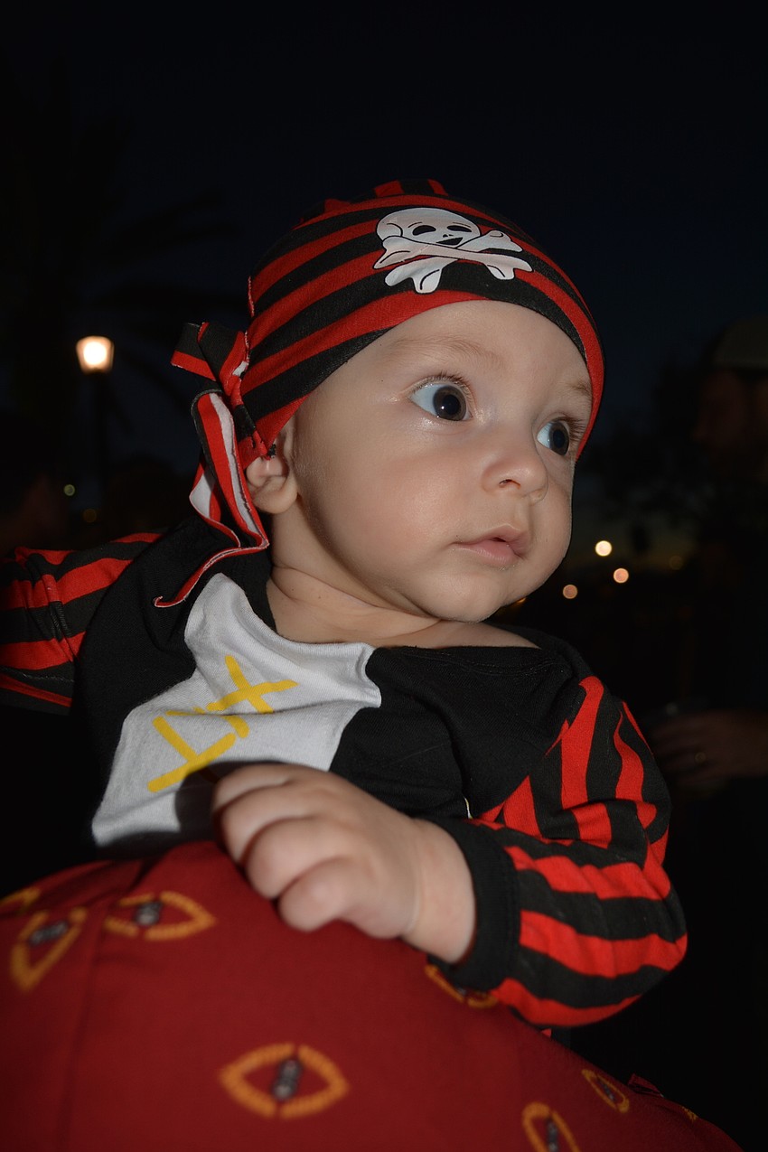 Paul Romonita, 5-months, hitches a ride on his mom, Maddy's, shoulder.