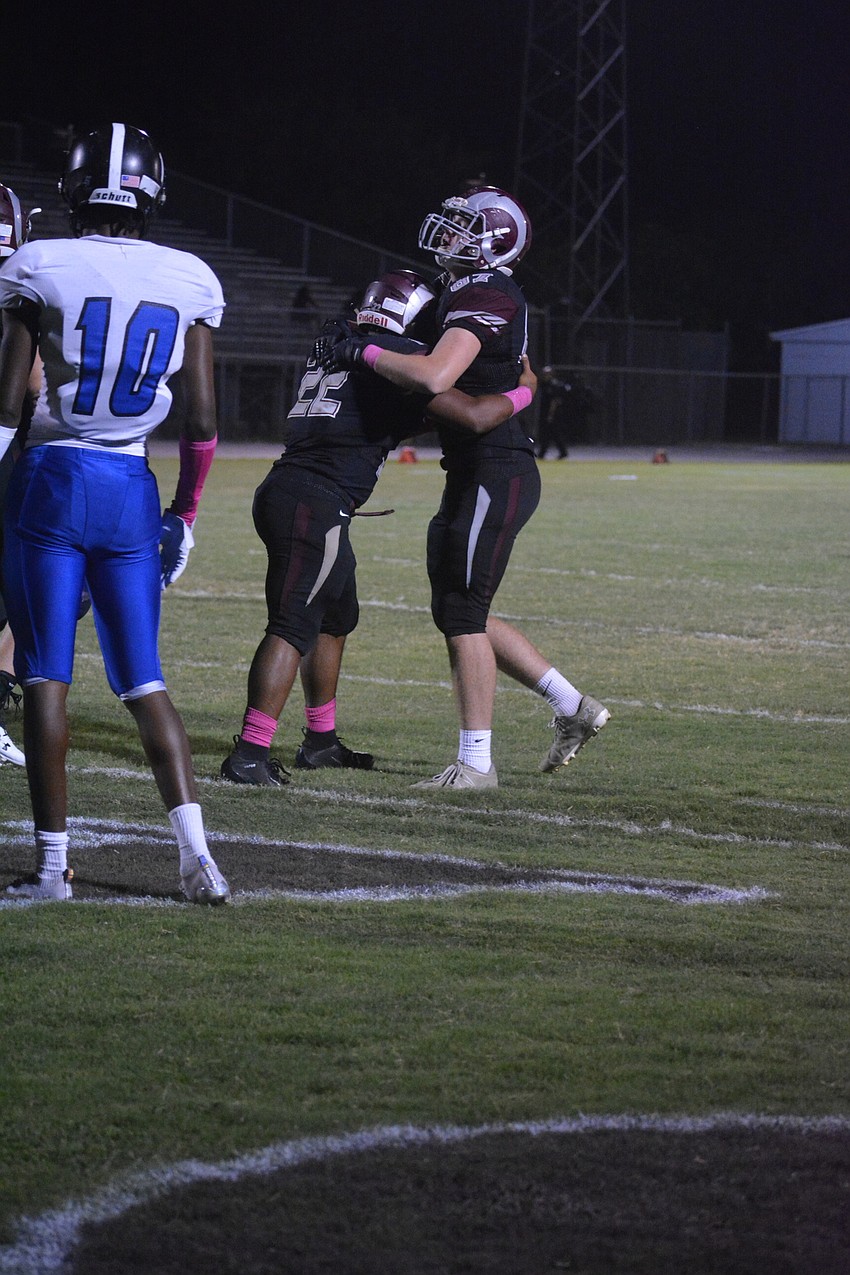 Senior RB Ali Boyce gets a hug from sophomore TE Michael Fraraccio after a touchdown.
