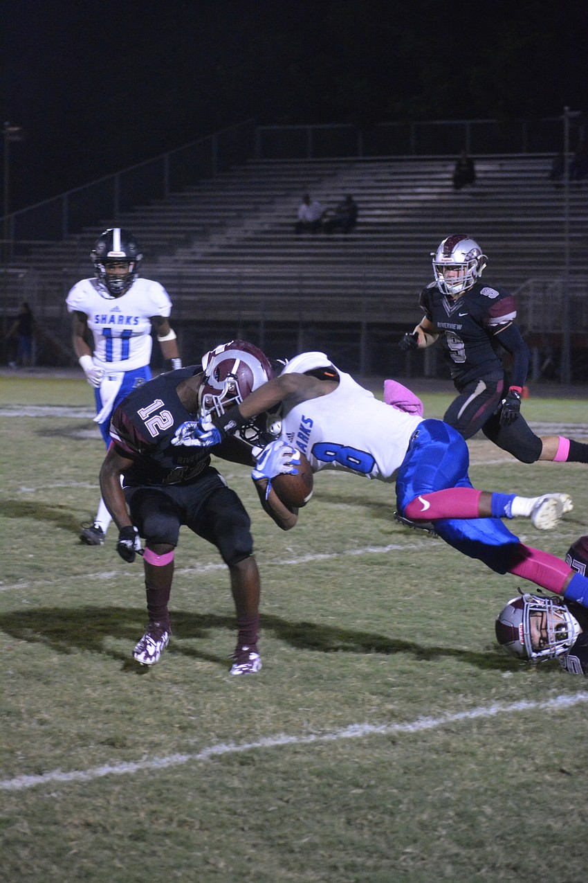 Freshman DB James Simmons (12)  gets a hard hit on a Sharks WR.
