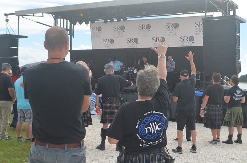 Sarasota's Beau Wilberding and Clearwater's Kris O'Meara rock out to Derek Warfrield and the Young Wolf Tones.