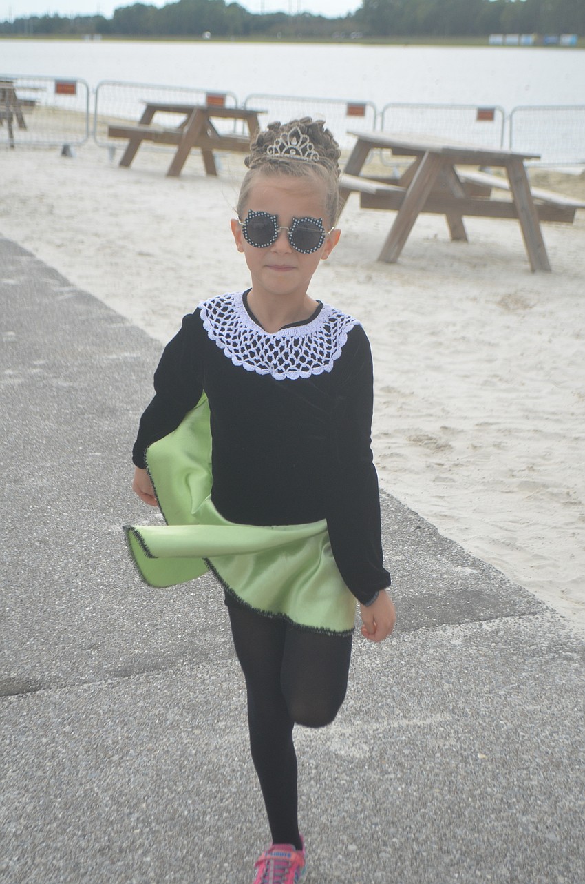 Irish Dance Academy of Sarasota's Astrid Fuller, 6, has to warm up before she and the rest of her dance troupe perform at the festival.